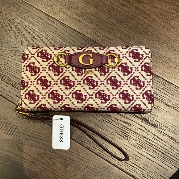 Brand new guess wallet. Colour is merlot and cream with brass hardware